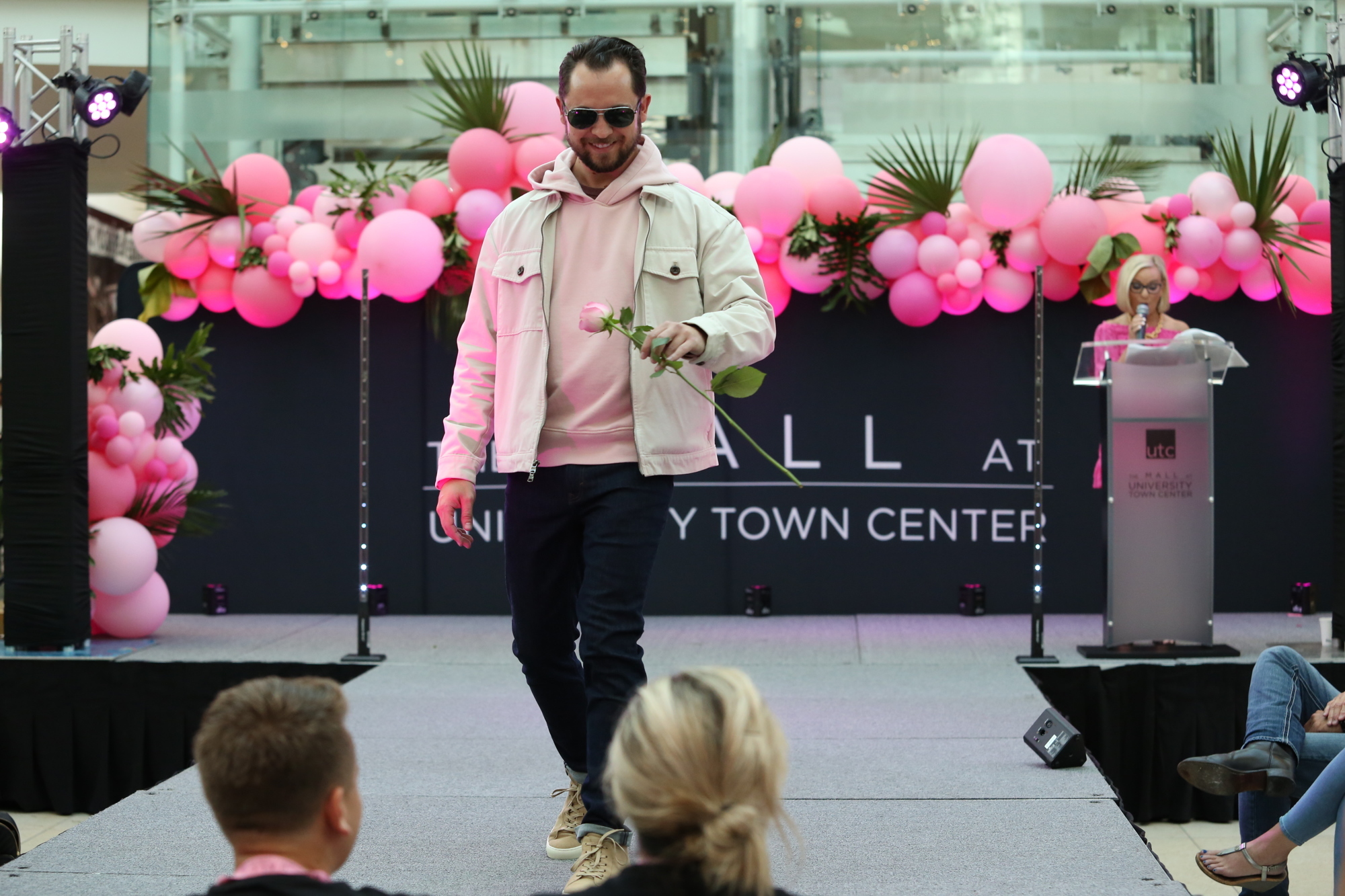 Scott Short hands off his rose at the 2021 Real Men Wear Pink Fashion Show. (File photo)