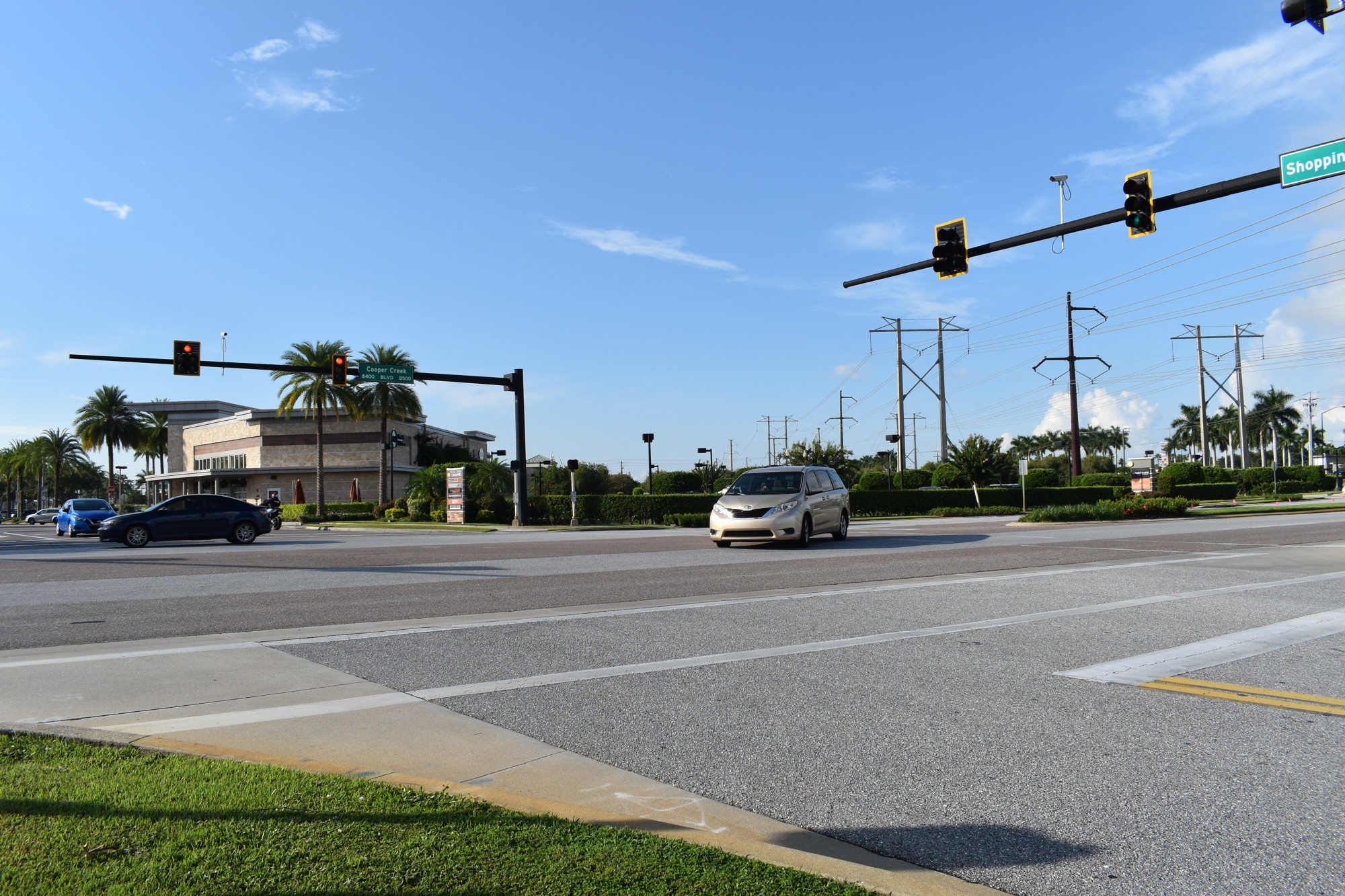 The traffic signal at the intersection at the entrance to The Shoppes at University Center will be replaced with a roundabout. (Photo by Ian Swaby)