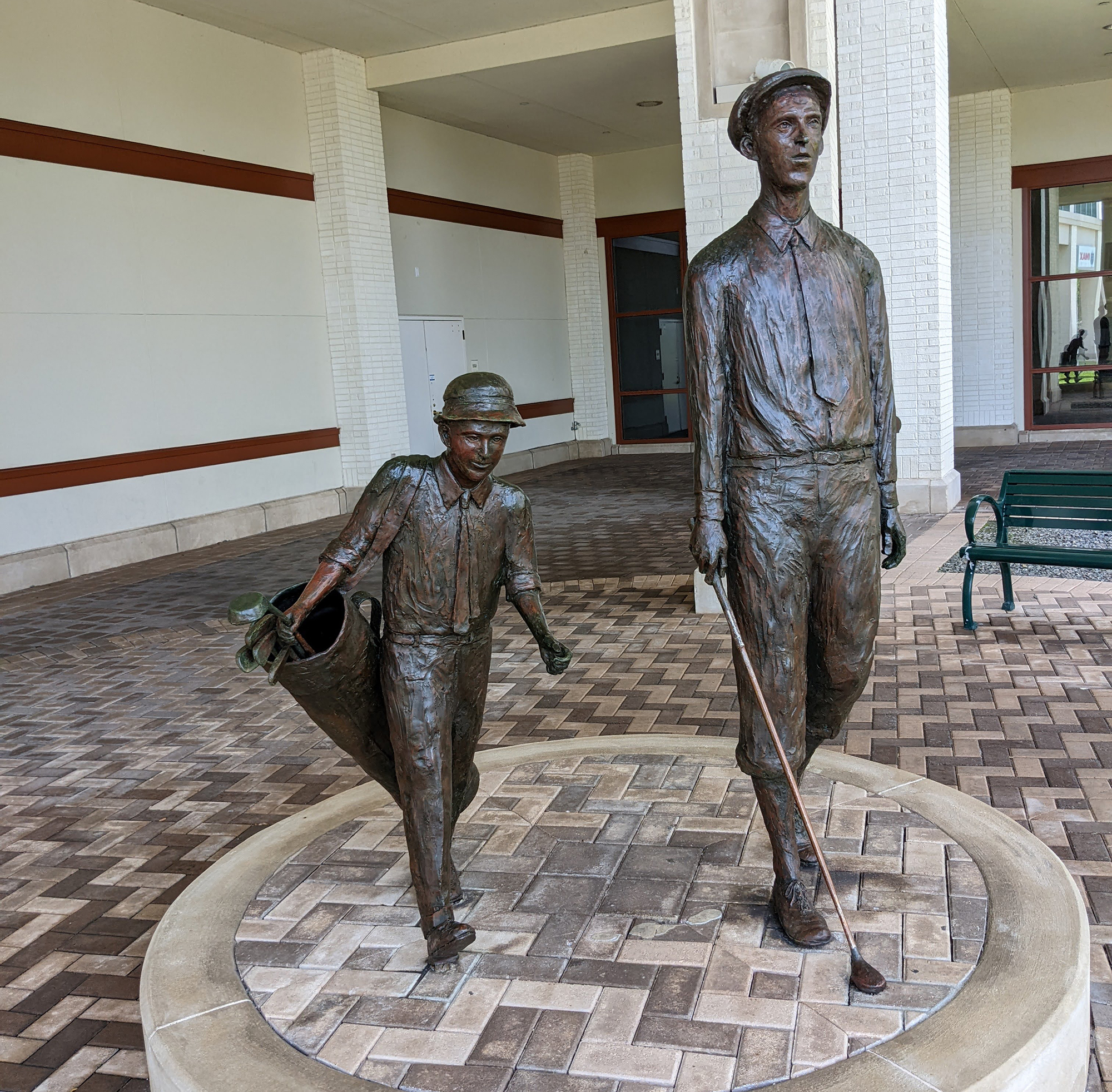 A statue depicting Francis D. Ouimet at the U.S. Open with his 10-year-old caddy, Eddie Lowery, at the Hall of Fame. Ouimet won the 1913 U.S. Open and was inducted into the World Golf Hall of Fame in 1974.