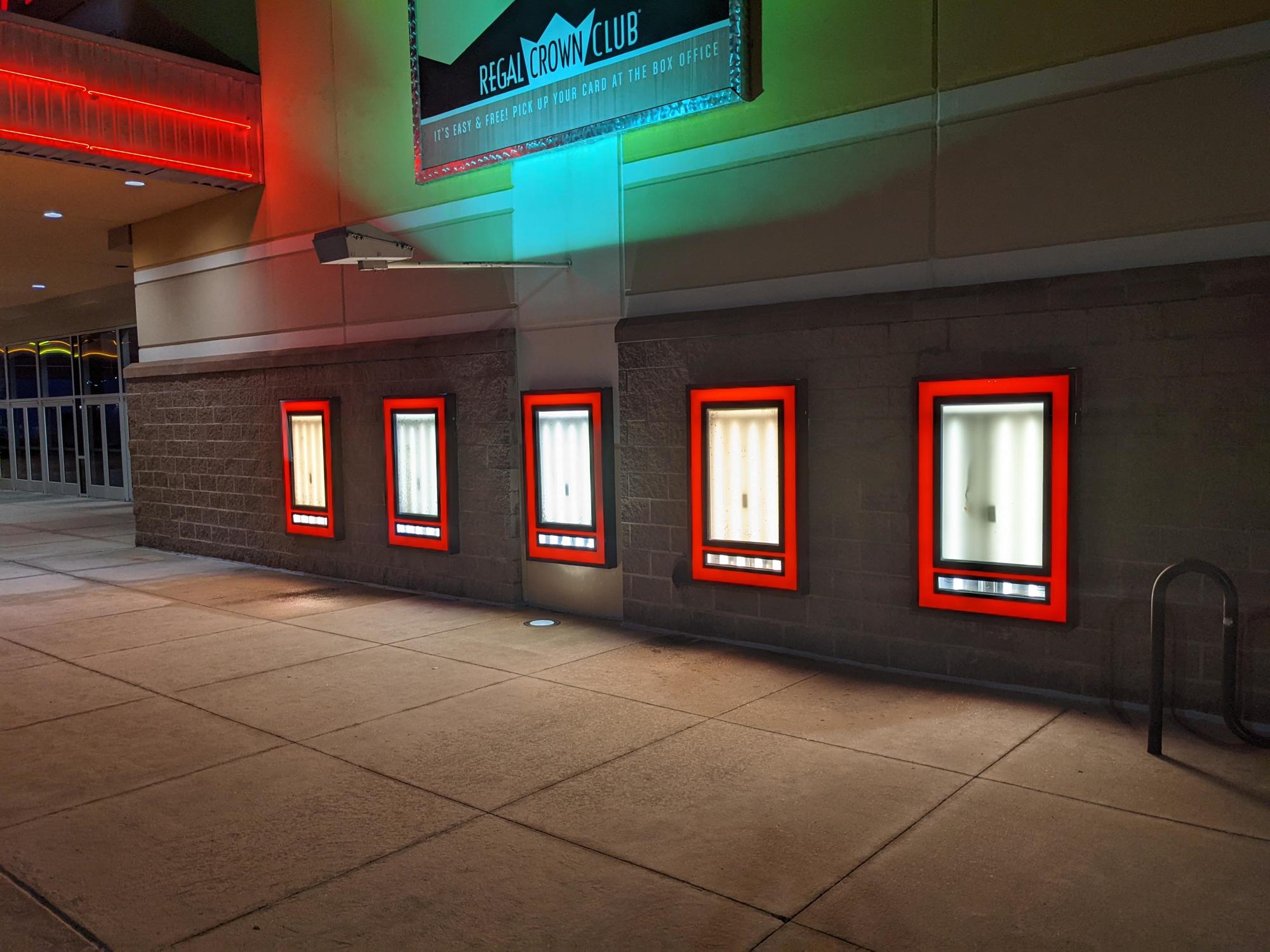 The exterior lights of the closed theater were on Aug. 27, but the now playing posters were removed.