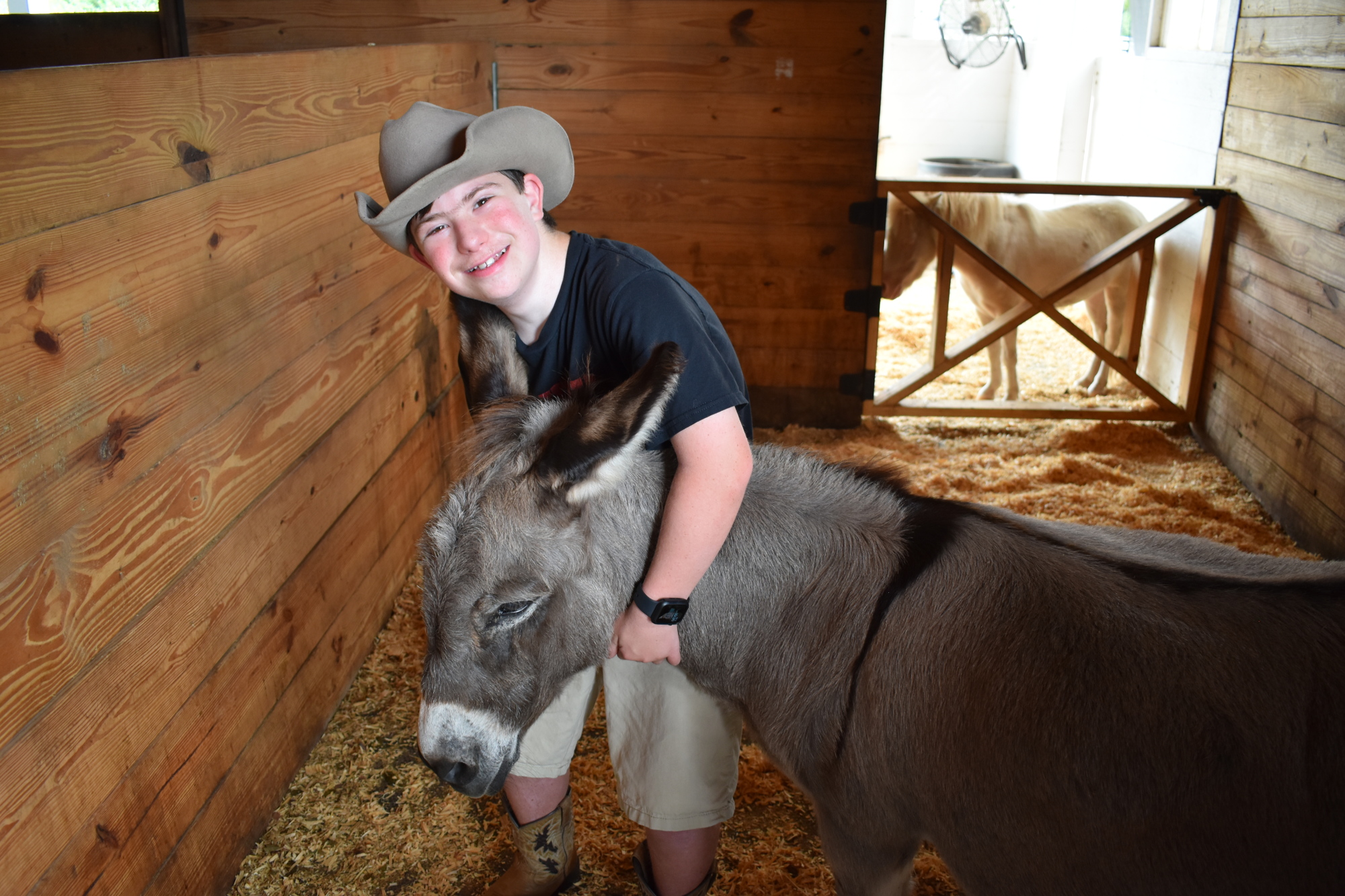 Lakewood Ranch's 13-year-old Mason Kramer has formed a bond with a donkey, named Donkey. (Photo by Ian Swaby)