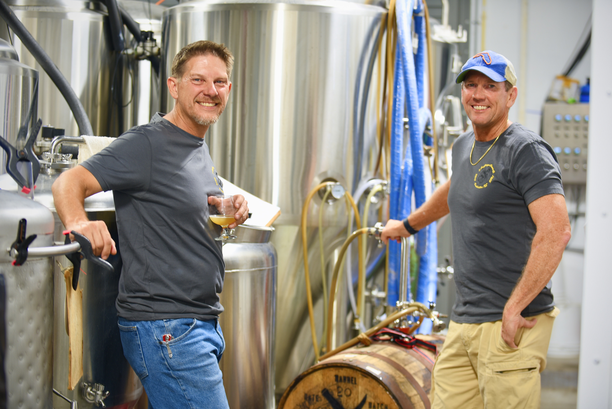 Stu Drymon and Darrell Jackson in their microbrewery behind the bar at  3 Car Garage. (Photo by Heidi Kurpiela)