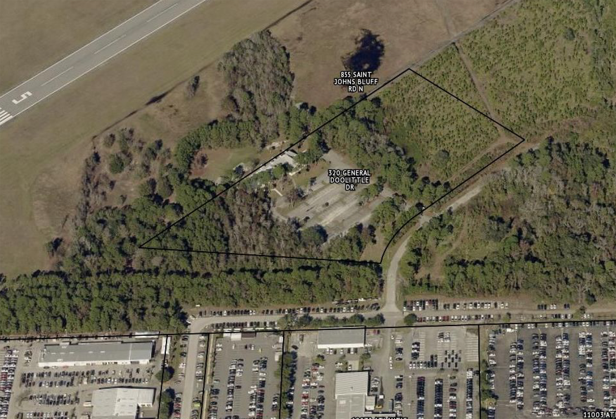 The 9.3-acre former restaurant site is behind the Arlington Toyota and George Moore Chevrolet car dealerships on Atlantic Boulevard.  The runway for Craig Field is shown in the top left.