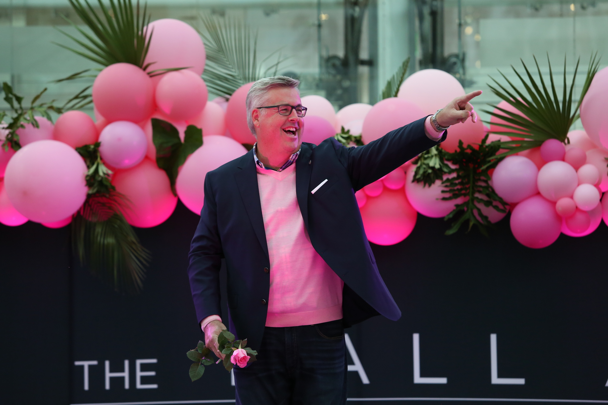 Lakewood Ranch's Ted Baran, who is one of this year's Real Men Wear Pink ambassadors, points to the crowd during last year's fashion show. (File photo)