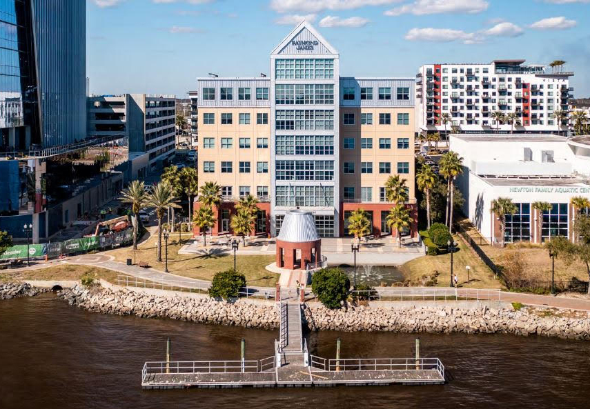 The 245 Riverside building is flanked by the new Fidelity National Information Services Inc. headquarters and the Winston Family YMCA.