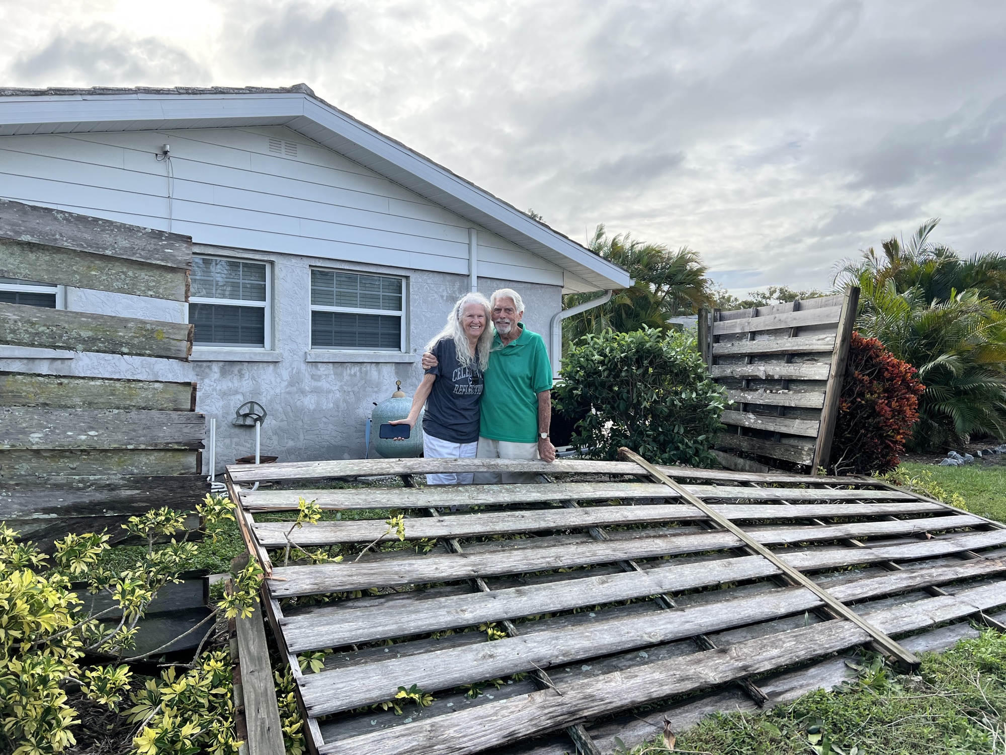 Pat and Hugh Beetham returned to their Southgate home Thursday morning to find some downed fences and trees in their yard. (Photo by Kat Hughes)