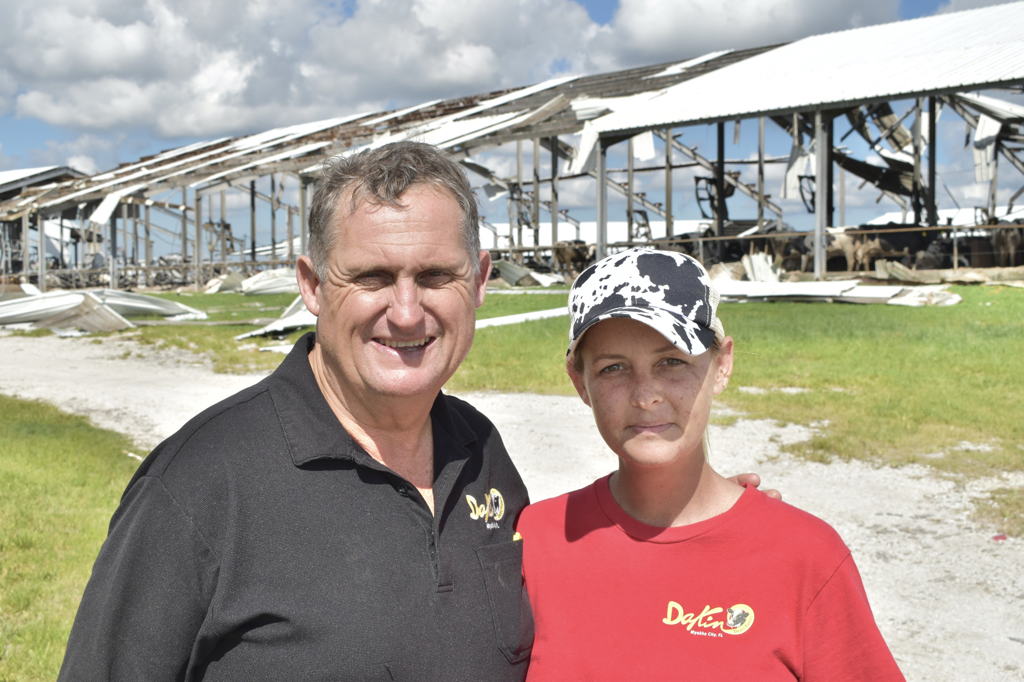 Owner Jerry Dakin and Tour Manager Courtney Dakin stand in front of a damaged barn. (Photo by Ian Swaby)