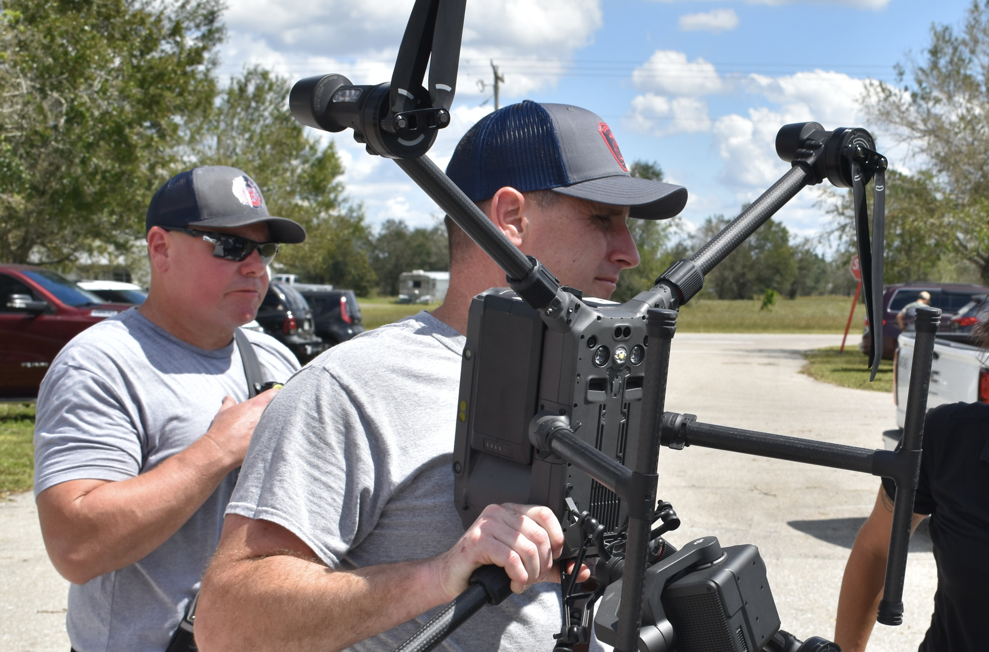Southern Manatee Fire Rescue staff members Eric Sigfried and Robert Davis prepare to work with Airborne International Response Team on a drone flight. (Photo by Ian Swaby)