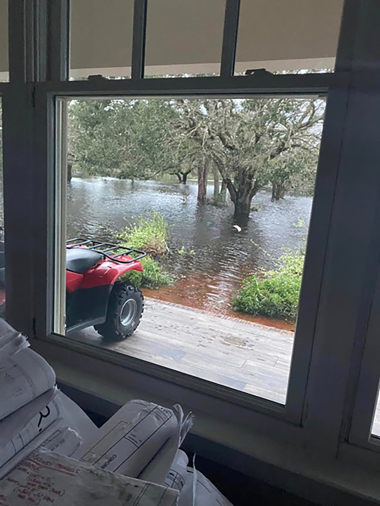 The water nears Rose and Clyde Alstrom's Myakka City home during Hurricane Ian. Clyde Alstrom and his family were able to evacuate before the water entered the house. (Courtesy photo)