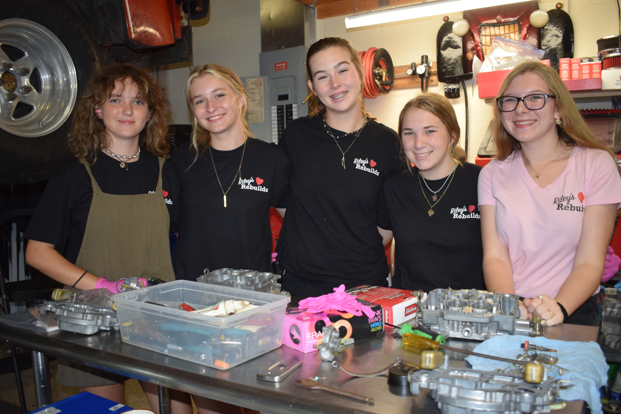 Amelia Sabo, Catie Burgess, Riley Schlick-Trask, Dagny Van Aken, and Elaine Zdancewicz make up the crew at Riley's Rebuilds. (Photo by Jay Heater)