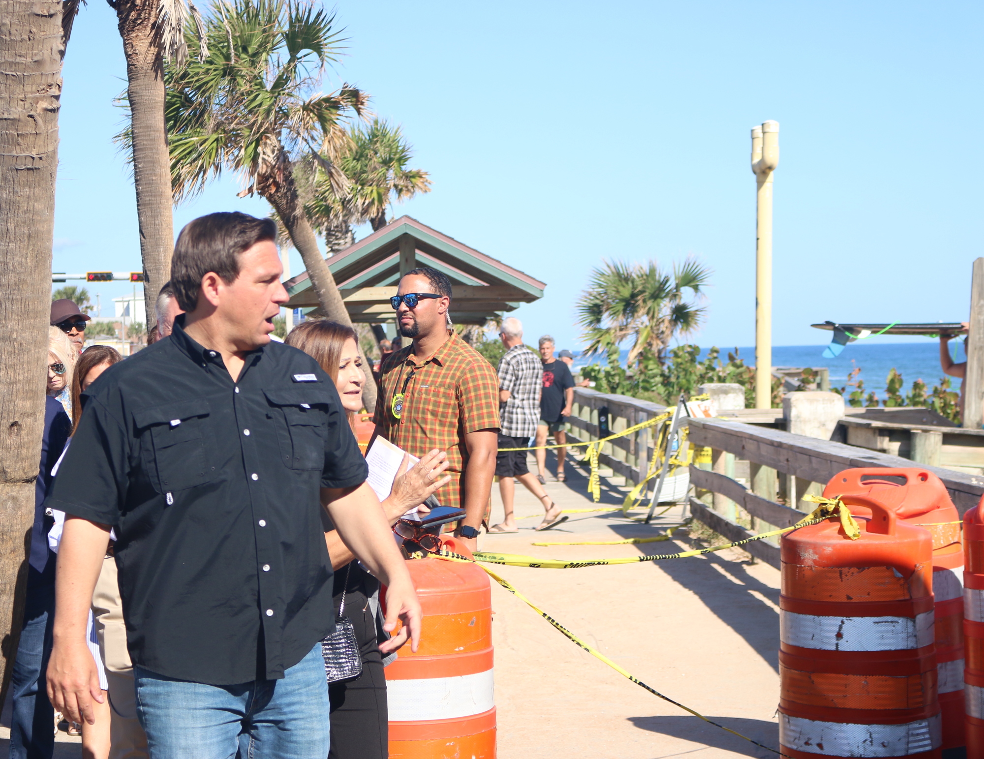 County engineer Faith Alkhatib (right) shows Florida Governor Ron DeSantis (left) the damage to Flagler Beach pier and beach. Photo by Sierra Williams