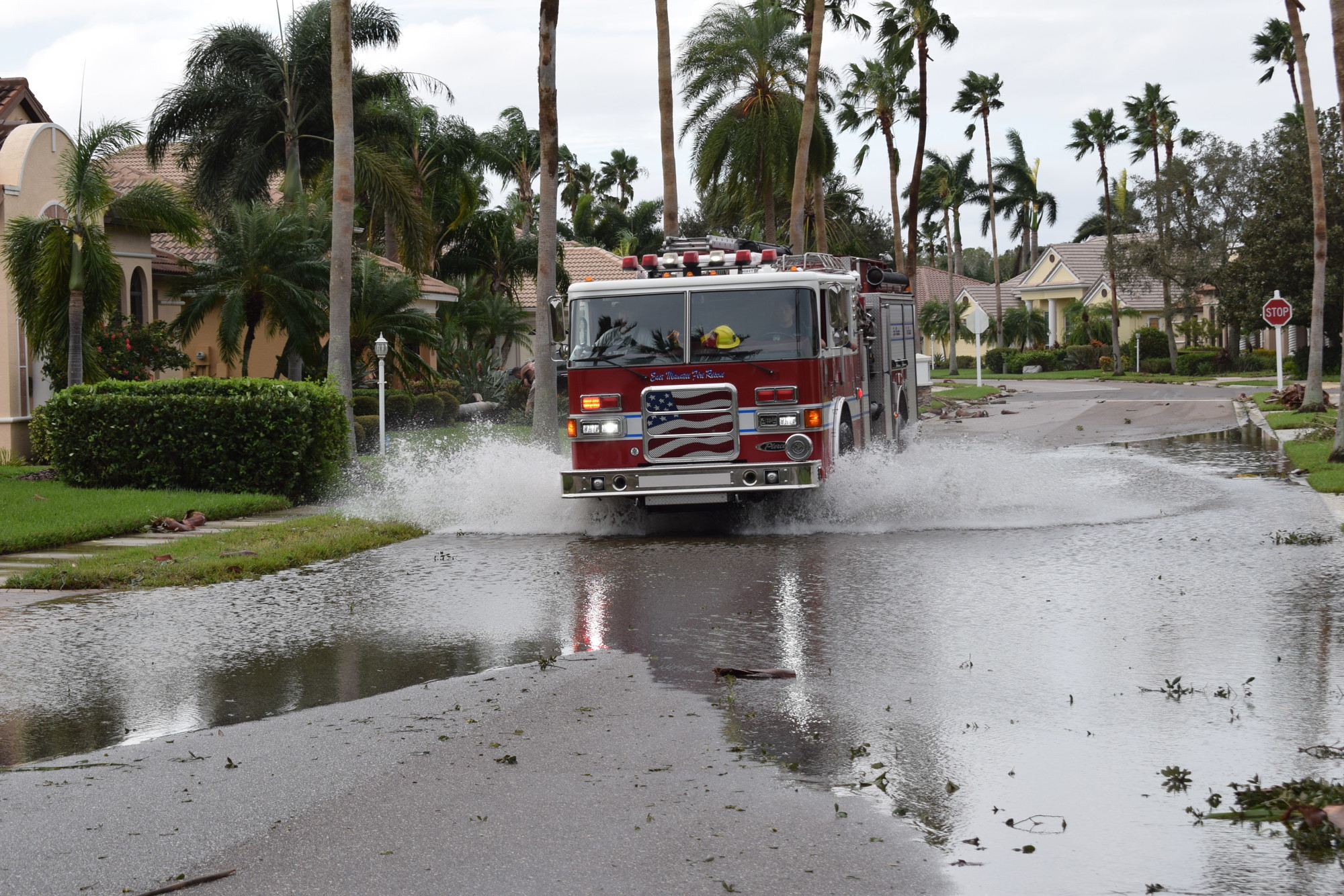 An East Manatee Fire Rescue truck goes through a flooded spot on The Masters Avenue in the Country Club. (Photo by Jay Heater)