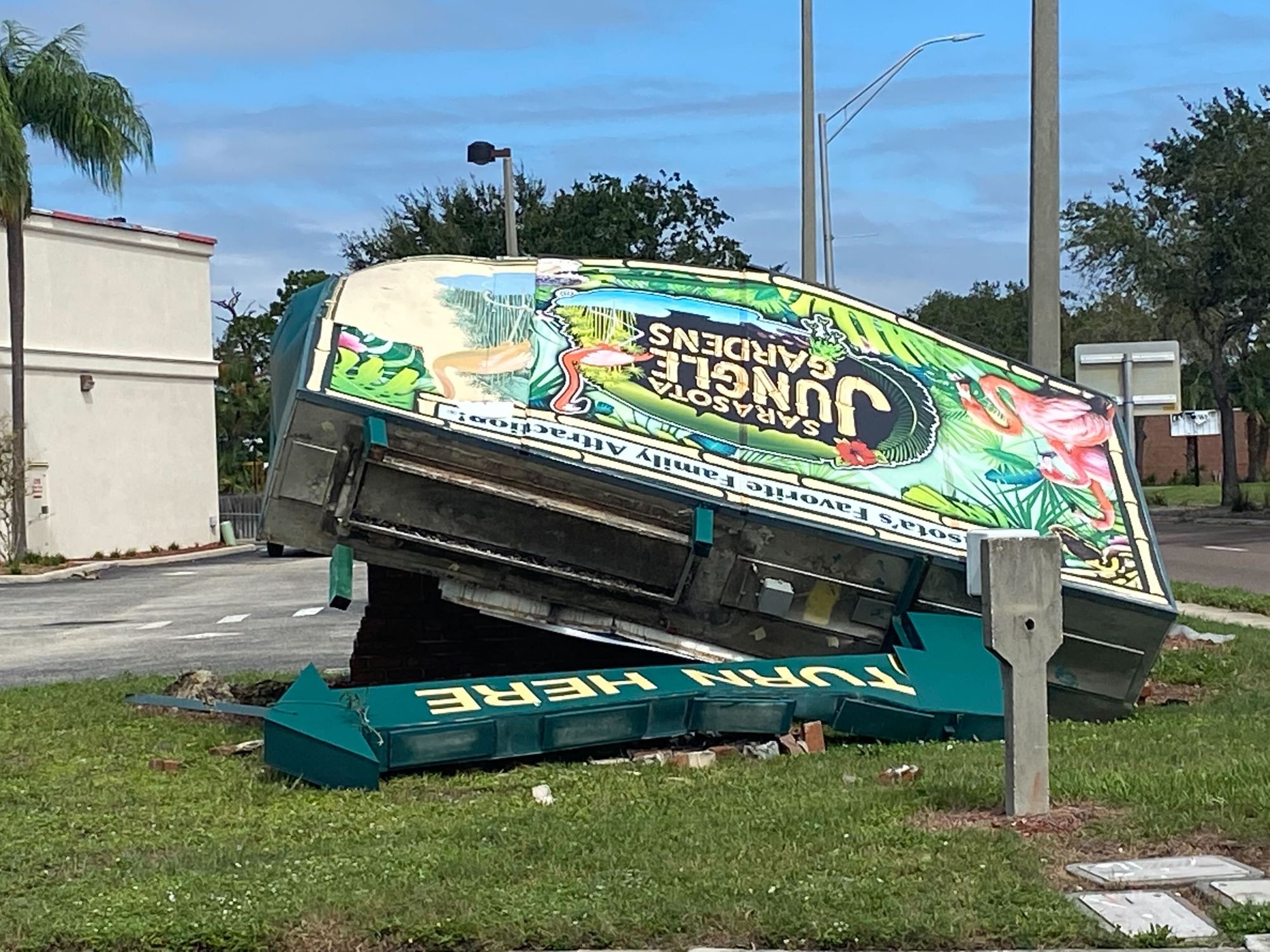 The Sarasota Jungle Gardens sign toppled in Hurricane Ian. (Photo by Spencer Fordin)