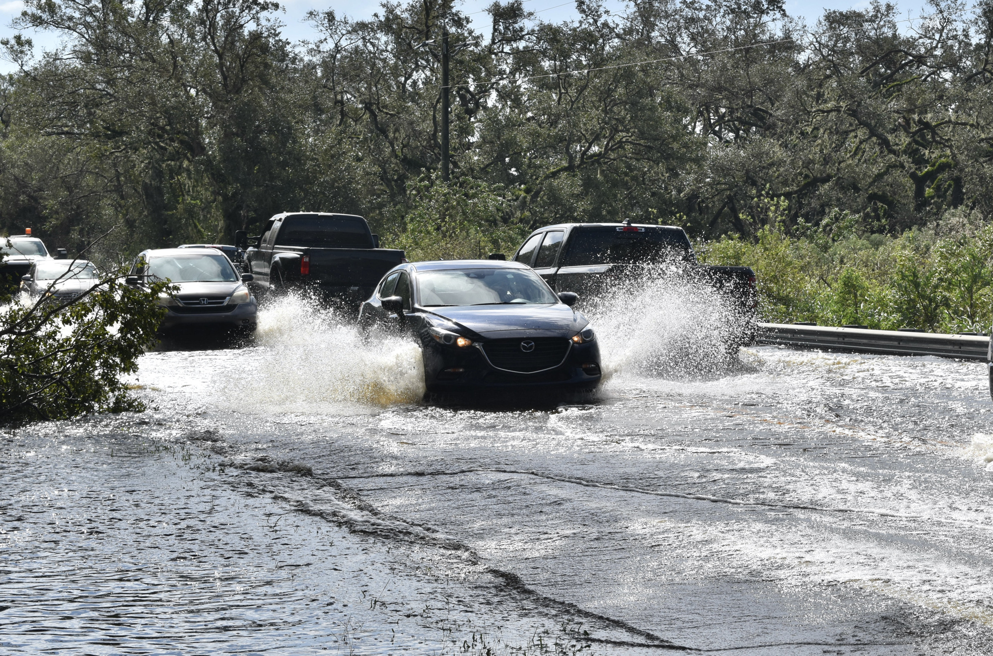 State Road 70 near Myakka City is flooded Thursday afternoon. County officials emphasize it is dangerous to drive through standing water on roads. (Photo by Ian Swaby)
