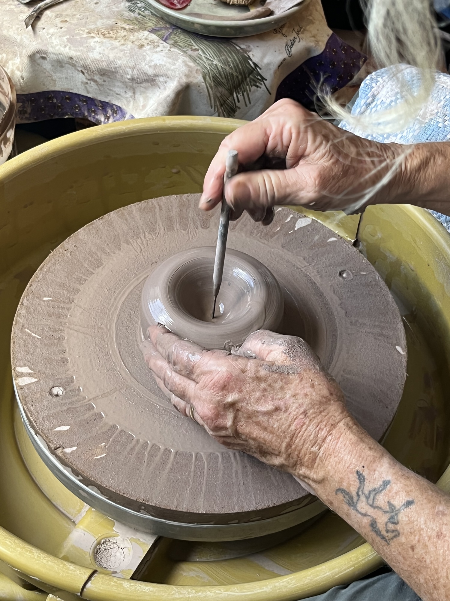 Panther Ridge's Denise Millett-Olverson says it takes her only about 10 minutes to create a bowl using clay, but the whole process from start to finish can take weeks. (Photo by Liz Ramos)