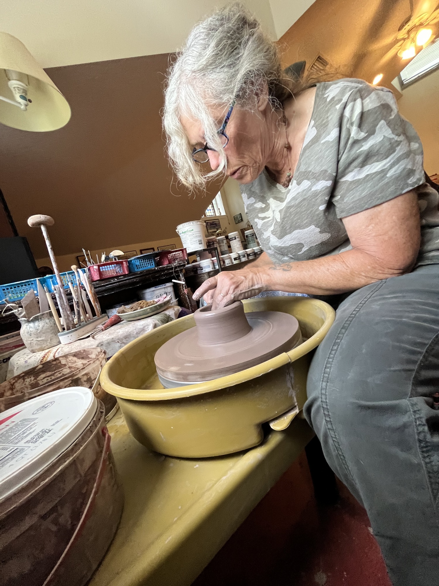 Panther Ridge's Denise Millett-Olverson says she's constantly thinking about different ways she can design her pottery. (Photo by Liz Ramos)