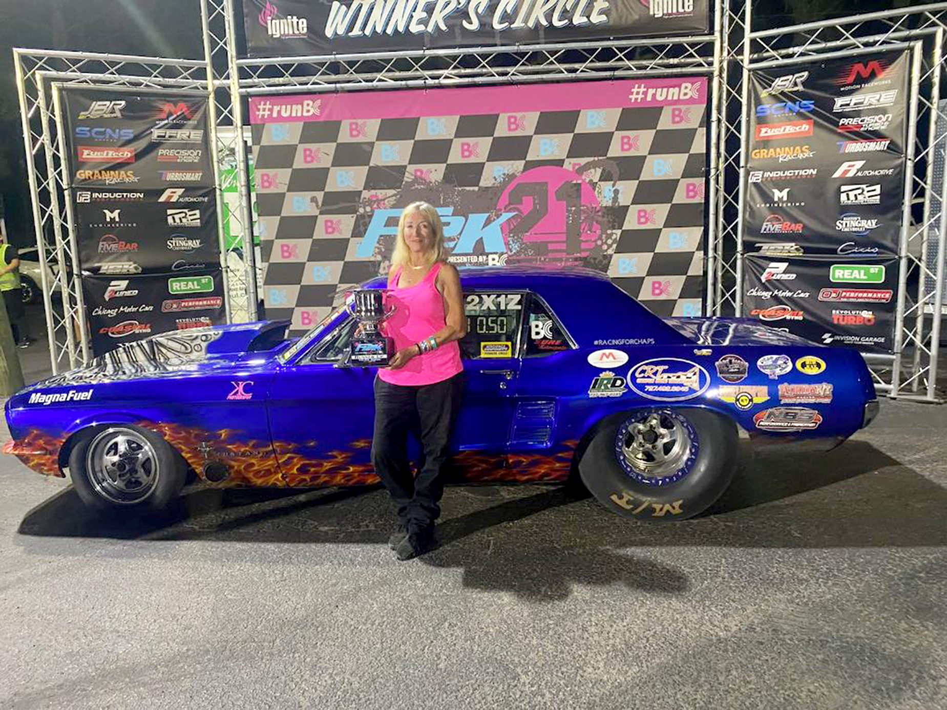 Faith Frost poses in the winner's circle after snatching a victory in the 10.50 index of the 2022 FL2K race at Gainesville Raceway. Frost was given a $1,500 check for the win. (Courtesy photo.)
