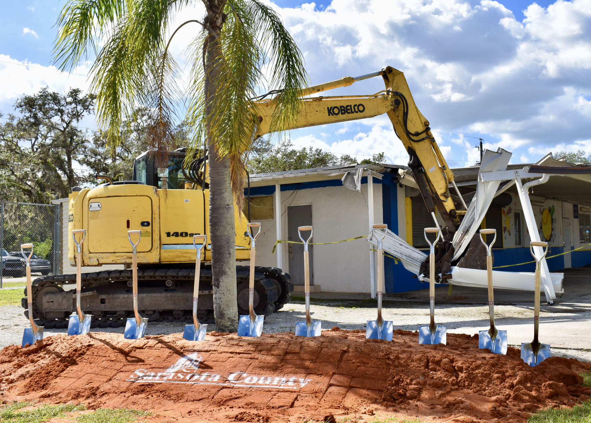 A piece of heavy machinery begins demolishing the concession stand at the 17th Street Park's Miss Sarasota softball complex. (Eric Garwood)
