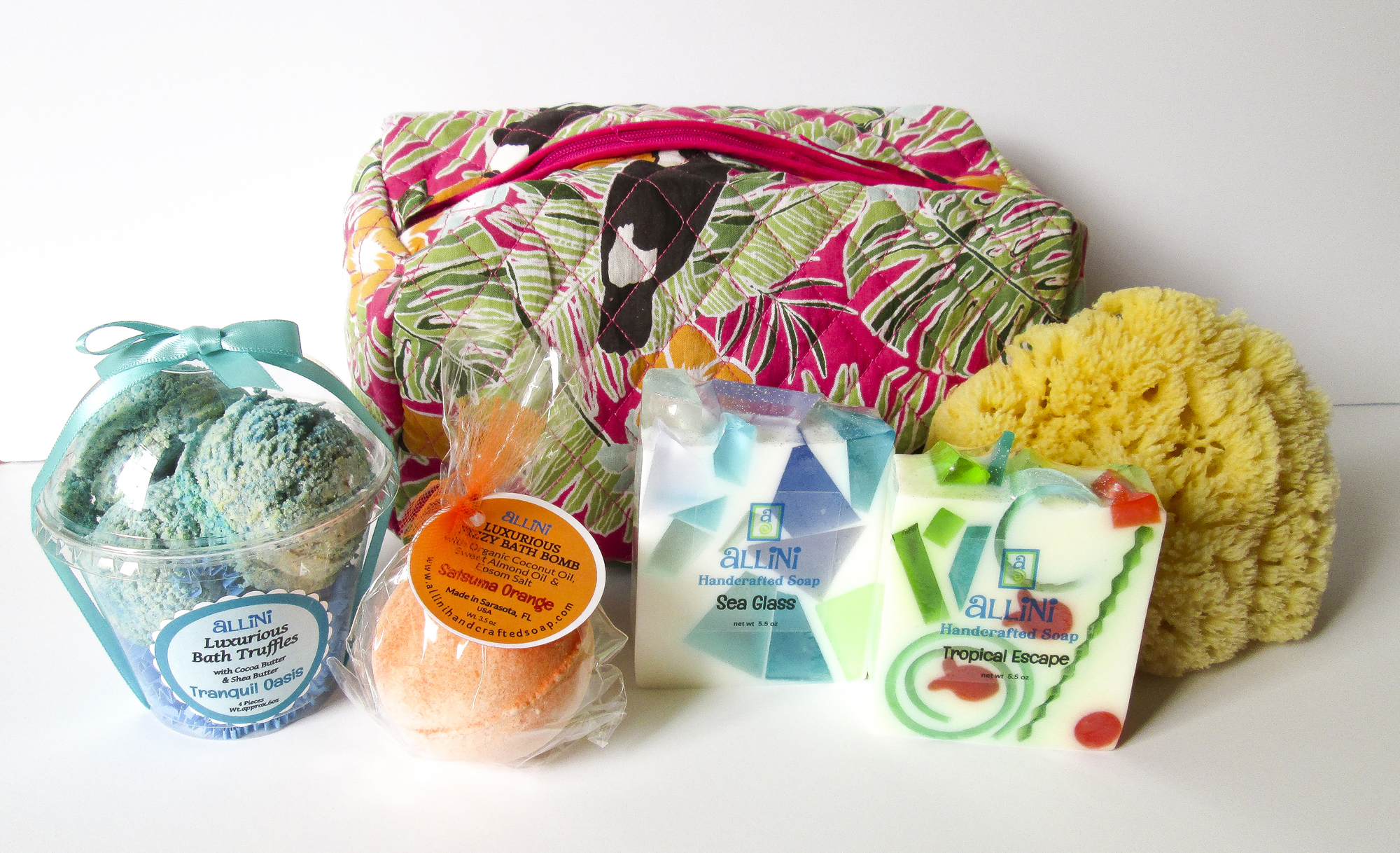 Allini fizzy bath truffles: $18.95. Allini bath bombs: $6.95. Allini artisan bar soap: $9.95. Set of 3 cosmetic bags: $59.95. Yellow natural sponge: $19.95.