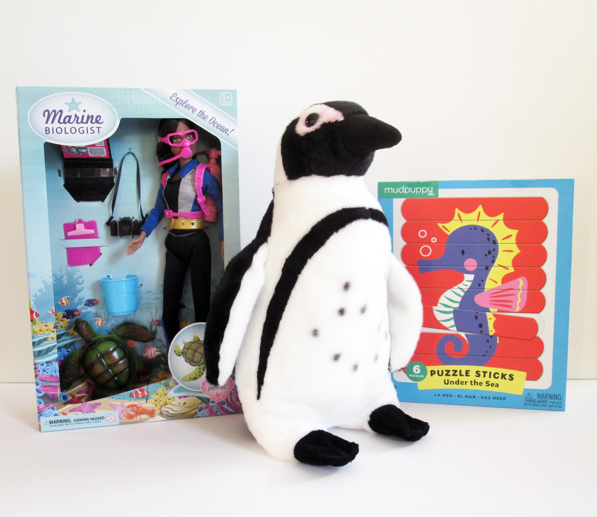 Marine biologist doll: $28. Plush penguin: $24. Puzzle sticks: $13.99.