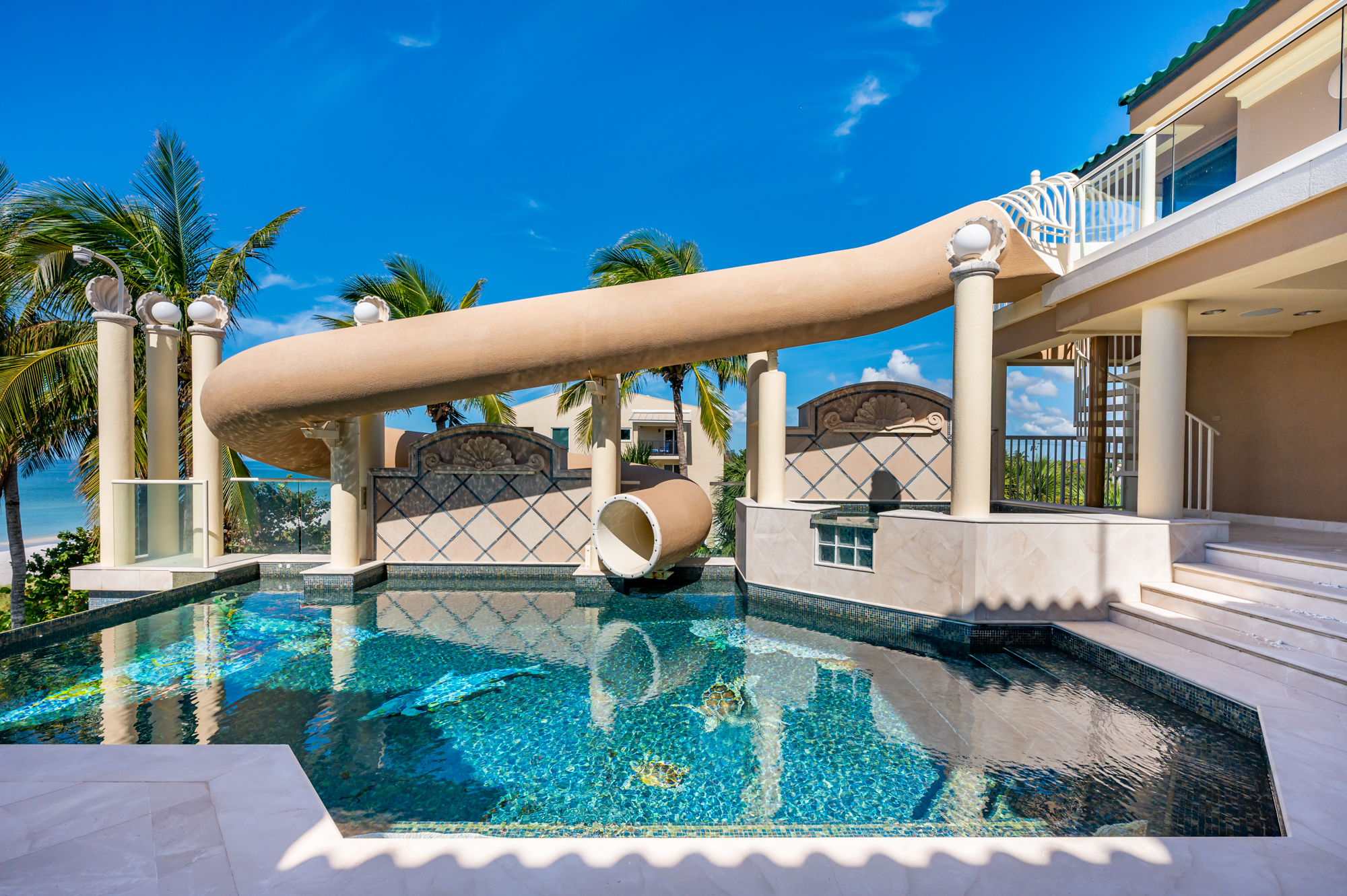 The waterslide leads from the rooftop down to the saltwater-filled infinity edge pool. (Courtesy photo)